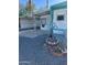 Mobile home with gravel landscaping and decorative features at 9623 E Baywood Ave, Mesa, AZ 85208