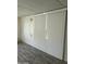 Spacious living area featuring wood-look floors and white blinds at 9623 E Baywood Ave, Mesa, AZ 85208