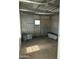 Unfinished storage area with corrugated metal walls at 9623 E Baywood Ave, Mesa, AZ 85208