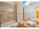 Modern bathroom with updated vanity and shower/tub combo at 10201 E Ranch Gate Rd, Scottsdale, AZ 85255