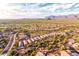 Aerial view of homes and desert landscape in Peralta Trails at 10284 E Meandering Trail Ln, Gold Canyon, AZ 85118