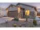 House exterior at dusk with desert landscaping at 10284 E Meandering Trail Ln, Gold Canyon, AZ 85118