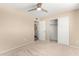 Spacious bedroom with carpet, closet, and access to bathroom at 1079 S Lawther Dr, Apache Junction, AZ 85120