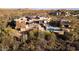 Luxury home nestled in the desert landscape with a pool at 11271 E Cinder Cone Trl, Scottsdale, AZ 85262