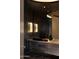 Spa-like bathroom with modern vessel sink and dark accents at 11271 E Cinder Cone Trl, Scottsdale, AZ 85262