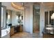 Spa-like bathroom with double vanity, soaking tub, and glass shower at 11271 E Cinder Cone Trl, Scottsdale, AZ 85262