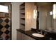 Bathroom with a shower, vanity with shelves, and dark countertop at 11271 E Cinder Cone Trl, Scottsdale, AZ 85262
