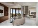 Main bedroom with fireplace, sitting area, and access to pool at 11271 E Cinder Cone Trl, Scottsdale, AZ 85262