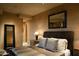 Tranquil bedroom with a king-size bed and ensuite bathroom access at 11271 E Cinder Cone Trl, Scottsdale, AZ 85262