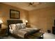 Comfortable bedroom with a king-size bed and neutral decor at 11271 E Cinder Cone Trl, Scottsdale, AZ 85262