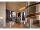 Modern dining room with glass table, stylish chairs, and wine cellar access at 11271 E Cinder Cone Trl, Scottsdale, AZ 85262