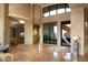 Elegant entryway with high ceilings and modern art at 11271 E Cinder Cone Trl, Scottsdale, AZ 85262