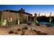 Desert contemporary home exterior with a pool and landscape at 11271 E Cinder Cone Trl, Scottsdale, AZ 85262