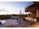 Stunning home exterior with a pool, patio, and desert landscape at 11271 E Cinder Cone Trl, Scottsdale, AZ 85262