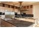 Modern kitchen boasting stainless steel appliances and granite island at 11271 E Cinder Cone Trl, Scottsdale, AZ 85262