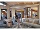 Open living area with contemporary furniture and a unique fireplace feature at 11271 E Cinder Cone Trl, Scottsdale, AZ 85262