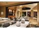 Open living space with comfortable seating and a large TV at 11271 E Cinder Cone Trl, Scottsdale, AZ 85262