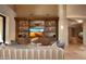 Stylish living room with built-in shelving and a modern aesthetic at 11271 E Cinder Cone Trl, Scottsdale, AZ 85262