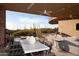 Spacious patio with outdoor dining area, pool, and scenic views at 11271 E Cinder Cone Trl, Scottsdale, AZ 85262