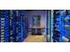 Well-lit wine cellar offering ample space for wine bottles at 11271 E Cinder Cone Trl, Scottsdale, AZ 85262