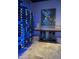 Custom wine cellar with extensive storage and artistic wall decor at 11271 E Cinder Cone Trl, Scottsdale, AZ 85262