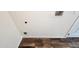 Laundry closet with hookups and wood-look flooring at 1222 N Palm Ln, Coolidge, AZ 85128