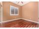 Bright bedroom with hardwood floors and plantation shutters at 1231 W Hawken Way, Chandler, AZ 85286