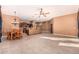 Kitchen and dining area with tile floor, chandelier, and ceiling fan at 1231 W Hawken Way, Chandler, AZ 85286