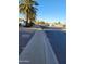 Residential street view with sidewalks and palm trees at 12414 N Pebble Beach Dr, Sun City, AZ 85351