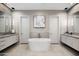 Elegant bathroom featuring a freestanding bathtub, dual sinks, and modern fixtures at 14517 E Buckboard Ct, Fountain Hills, AZ 85268