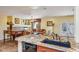 Kitchen features granite island, view into living room, and a breakfast nook at 15147 W Double Tree Way, Surprise, AZ 85374