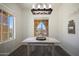 Bright dining room with large windows and farmhouse decor at 16926 W Sonora St, Goodyear, AZ 85338