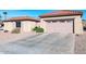 Two-car garage with automatic door opener and ample driveway space at 17808 N Navarro Ct, Surprise, AZ 85374