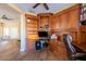 Home office with built-in wooden desk and shelving at 17808 N Navarro Ct, Surprise, AZ 85374