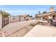 Large gravel backyard with block wall and covered patio at 2110 W Silvergate Dr, Chandler, AZ 85224