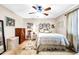 Bedroom with double bed, dresser, and ceiling fan at 2110 W Silvergate Dr, Chandler, AZ 85224