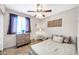 Bedroom with double bed, ceiling fan, and dresser at 2110 W Silvergate Dr, Chandler, AZ 85224