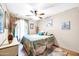 Bedroom with double bed, ceiling fan, and coastal decor at 2110 W Silvergate Dr, Chandler, AZ 85224