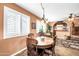 Bright dining room with a wooden table and built-in bar at 2110 W Silvergate Dr, Chandler, AZ 85224
