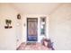 Front entry with wrought-iron door and terracotta tile flooring at 2110 W Silvergate Dr, Chandler, AZ 85224