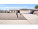 Single-story house with a two-car garage and gravel landscaping at 2110 W Silvergate Dr, Chandler, AZ 85224