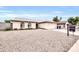 Single-story house with a two-car garage and gravel landscaping at 2110 W Silvergate Dr, Chandler, AZ 85224