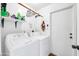 Laundry room with washer, dryer, and shelving at 2110 W Silvergate Dr, Chandler, AZ 85224