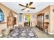 Bright living room with a fireplace and large windows at 2110 W Silvergate Dr, Chandler, AZ 85224