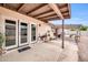 Covered patio with double doors and potted plants at 2110 W Silvergate Dr, Chandler, AZ 85224
