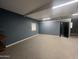 Garage with ample space, built-in shelving, and painted walls at 24201 N 181St Dr, Surprise, AZ 85387