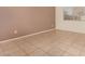 Spacious bedroom with tile floors and neutral colored walls at 3002 W Irma Ln, Phoenix, AZ 85027