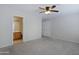 Bright bedroom with plush carpeting and private bathroom access at 4047 E Rowel Rd, Phoenix, AZ 85050