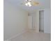 Spacious bedroom with ceiling fan and double door closet at 4047 E Rowel Rd, Phoenix, AZ 85050