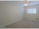 Bright bedroom with ceiling fan and carpet flooring at 4047 E Rowel Rd, Phoenix, AZ 85050